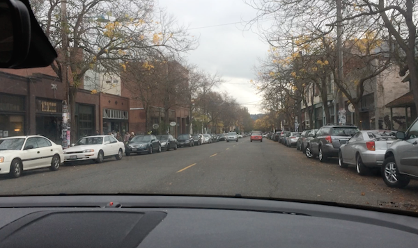 image of street crowded with parked cars